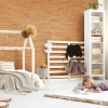Wicanders Dekwall in Bali - a room view of a little girl lying on the floor of her natural colored bedroom with cork wall paneling.