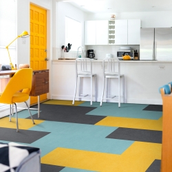 Marmoleum Click CinchLoc Panels Shown in Volcanic Ash, Aqua, and Lemon Zest