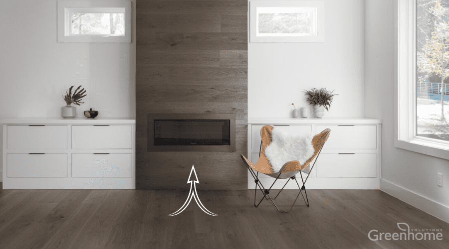 Valinge Hardened Wood Flooring in Mineral Grey Oak (a brownish-grey color) shown on the floor as well as on the wall encasing a gas fireplace insert. Demonstrating their installation system for converting flooring to wall covering.